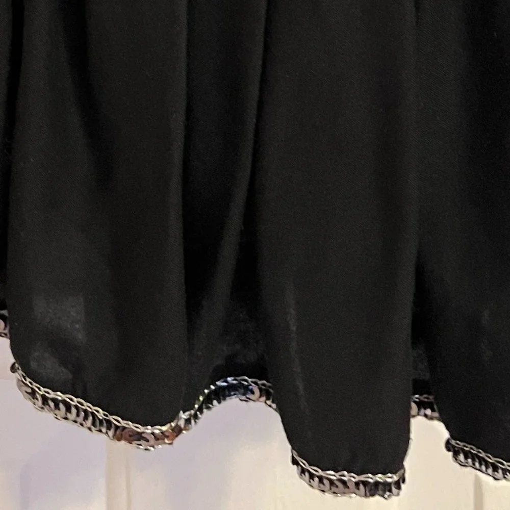 Justice black skort with silver sparkly trim along waistline and hem sz 12